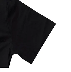 Detailed close-up of the black breathable linen fabric and sleeve of a mens Henley shirt.