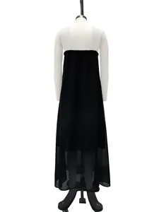 Elegant back view of a black sleeveless maxi dress featuring a semi-sheer chiffon hem detail
