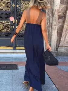 Back view of a loose-fitting color-block sleeveless maxi dress in navy blue and brown