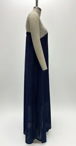 Side view of a loose sleeveless patchwork maxi dress on a dress form mannequin.