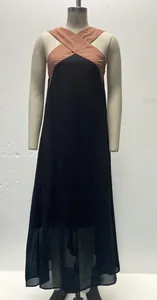 Detail shot of a cross-neck color-block sleeveless maxi dress on a mannequin.