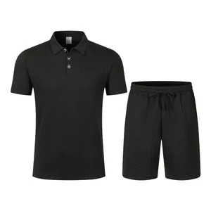 Close-up of black jacquard knit polo shirt and matching shorts leisure set