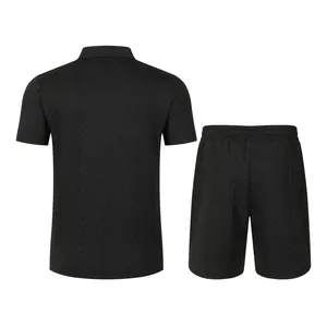 Back view showing texture of men's black jacquard knit polo shirt and shorts set