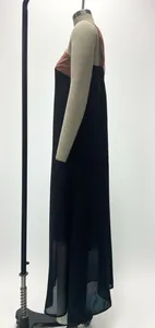 Side view of a sleeveless color-block maxi dress with sheer hem details