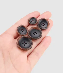 Close-up of high-end dark marble urea buttons for luxury garments