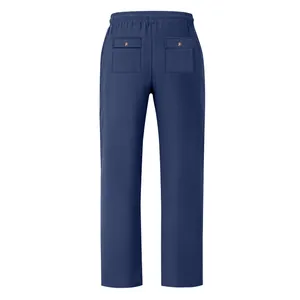 Back view of blue linen pants featuring elastic waistband and buttoned rear pockets