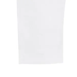 Close-up detail of white linen pants showing fabric texture and neat hem stitching