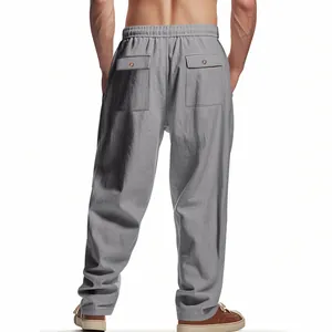 Back view of men's loose gray linen work pants with two buttoned back pockets.