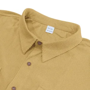 Close-up of yellow corduroy shirt collar with size XXL and material tag