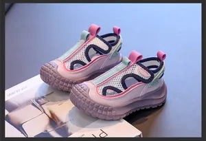 Detailed macro view of breathable mesh kids sandals with purple and pink accents