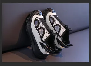Detailed macro shot of children's breathable black and white mesh sports sandals