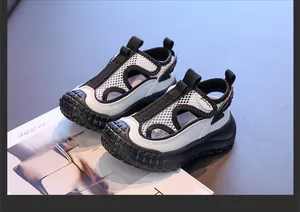 Close-up of white and black breathable mesh sports sandals for children with closed-toe design