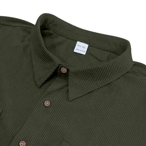 Detailed macro view of dark olive green corduroy shirt collar and heavy fabric texture