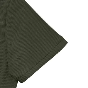Macro detail of olive green heavy corduroy fabric on American Amekaji style men's shirt