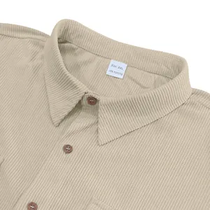 Detail view of khaki corduroy shirt collar with size XXL tag and button accents