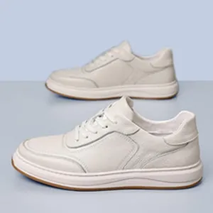 Detail of men's premium white leather sneakers with pebbled texture and thick soles