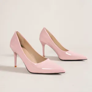 Detailed side view of elegant pink patent leather stiletto pumps with pointed toe