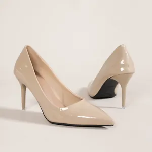 Nude patent leather pointed-toe stiletto pumps with sleek high heels for professional wear