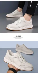 Close-up detail view of men's premium white leather sneakers with breathable texture.