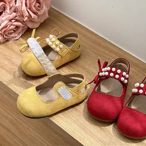 Elegant toddler girl princess shoes featuring pearl straps and bow details on soft soles.