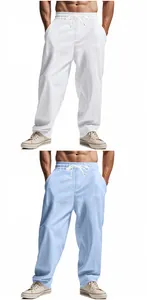 Men's loose linen trousers in white and light blue featuring a drawstring waist.