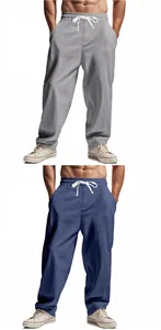 Detail view of men's loose linen drawstring casual pants in gray and blue colors