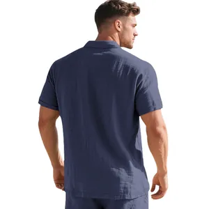 Back view of a breathable navy blue linen polo shirt for men showing fabric detail