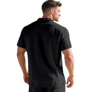Back view detail of a breathable black linen short sleeve polo shirt for men in loose fit