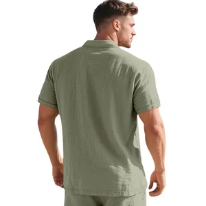 Detailed back view of a man wearing a breathable olive green short sleeve linen polo shirt