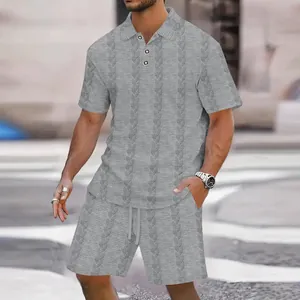 Detailed view of men's grey jacquard textured short sleeve polo and shorts set