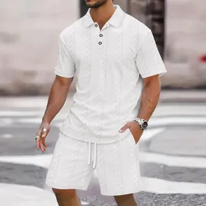 Detail of men's white jacquard texture polo shirt and matching drawstring shorts.