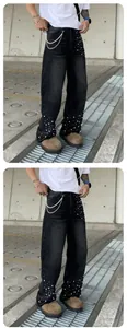 Men's loose straight-leg washed black jeans featuring decorative white pearl embellishments