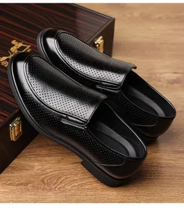 Close-up detail of black perforated leather dress shoes for men in professional style