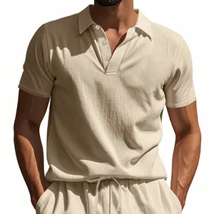 Close-up of men's linen polo shirt with breathable textured fabric in cream.