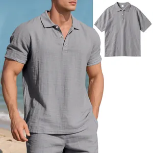 Close-up of a breathable grey linen polo shirt for men worn by a model at the beach