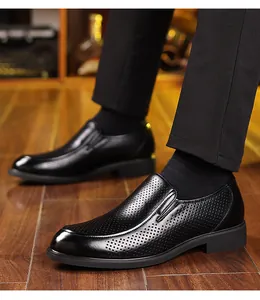 Close-up of men's black breathable business leather shoes with perforated texture