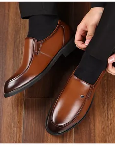Elegant brown leather dress shoes for men featuring a classic slip-on design for formal wear.