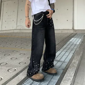 Loose straight-leg men's denim jeans with pearl bead accents and silver waist chain