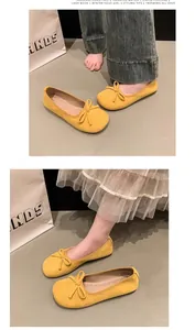 Eleganti ballerine in camoscio giallo con fiocco per lo stile primaverile delle donne