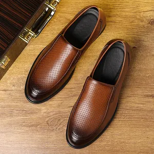 Elegant brown perforated leather loafers for men featuring business casual slip-on design