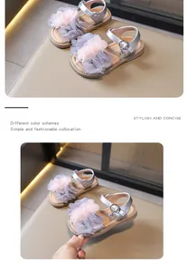 Silver girl's summer sandals featuring delicate pink layered tulle flower decoration