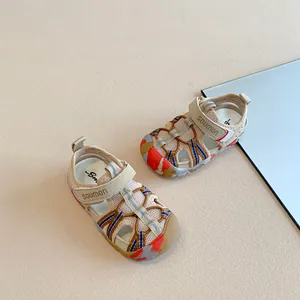 Detailed view of closed-toe children's sports sandals with mesh and woven straps