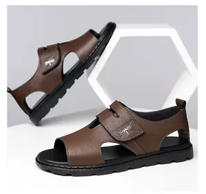 Detailed side view of men's brown leather sandals featuring soft soles and dragonfly logo