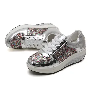 Women's silver mirror rocker sneakers with colorful sequins and platform sole.