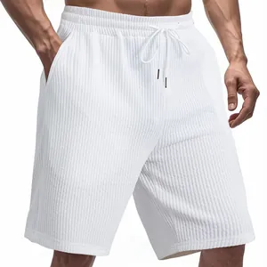 Detailed view of white men's shorts with heavy jacquard texture and adjustable drawstring