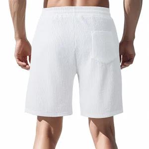 Detailed back view of white men's jacquard shorts showing pocket and textured fabric