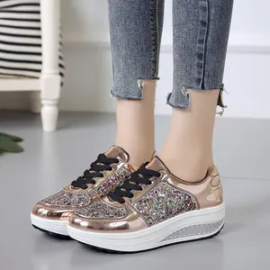 Detail view of rose gold metallic rocker sneakers featuring colorful sparkling glitter panels