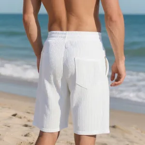 Rear view of white men's beach shorts featuring unique jacquard textured fabrics