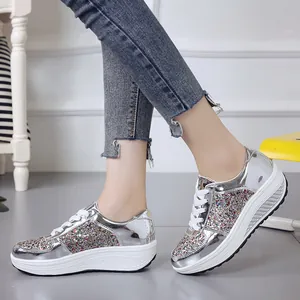 Stylish silver metallic platform sneakers featuring colorful glitter sequins detail