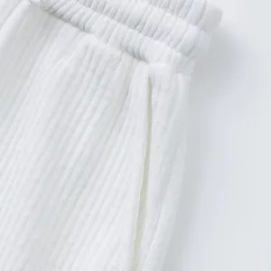 Close-up view of premium white jacquard fabric on men's luxury casual sports beach shorts